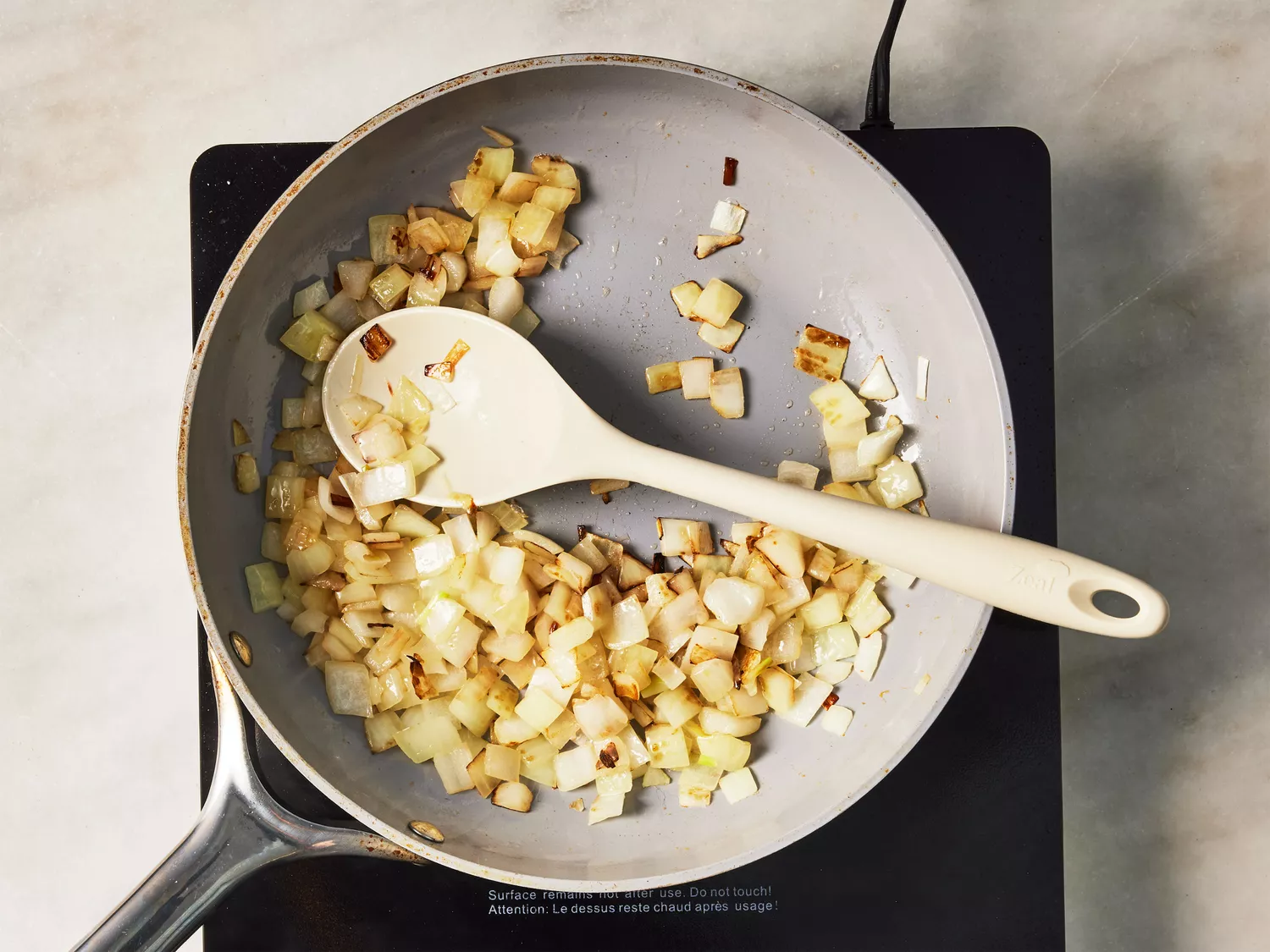 A skillet with browned chopped onions