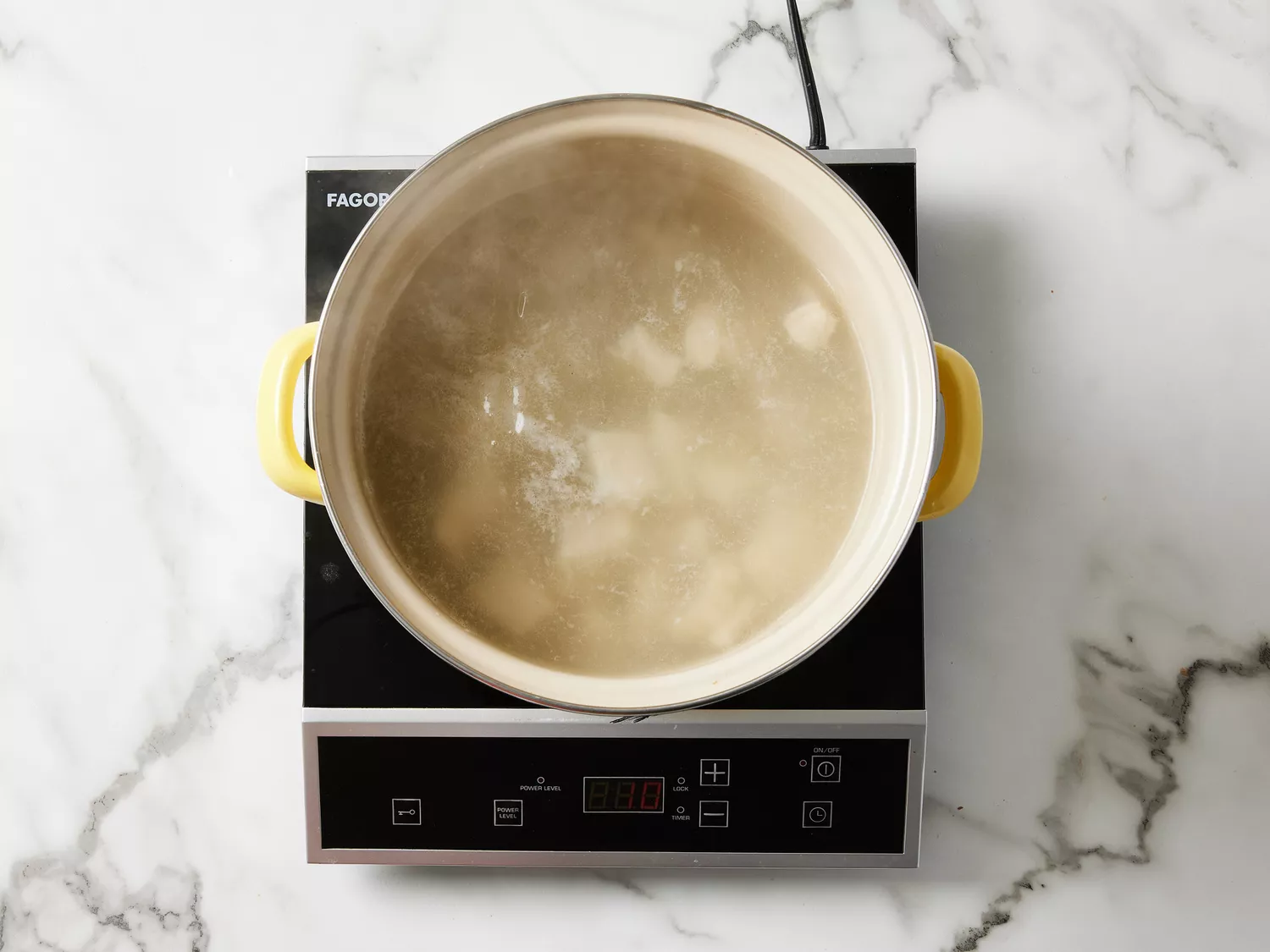 A large pot of tripe simmering in water