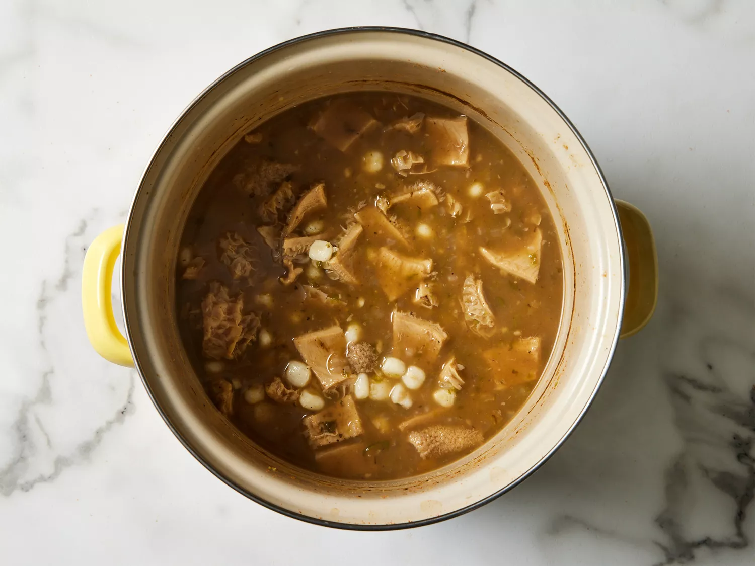 A pot of menudo rojo with tripe and hominy 