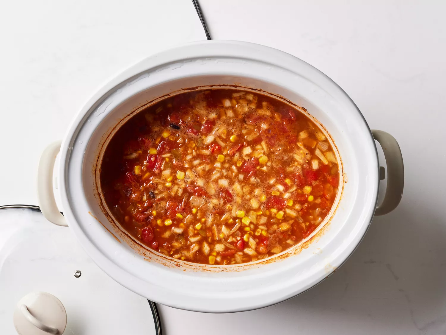 A crock pot with chicken taco soup