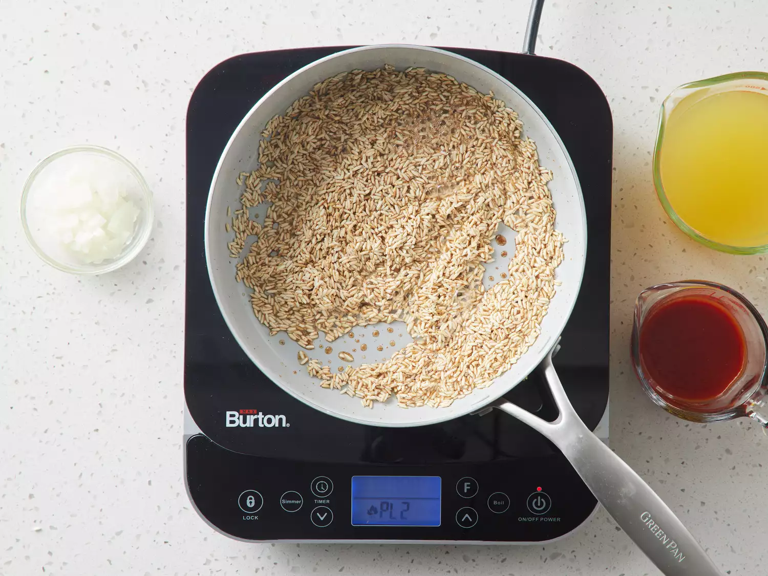 A small pan with toasted, seasoned rice