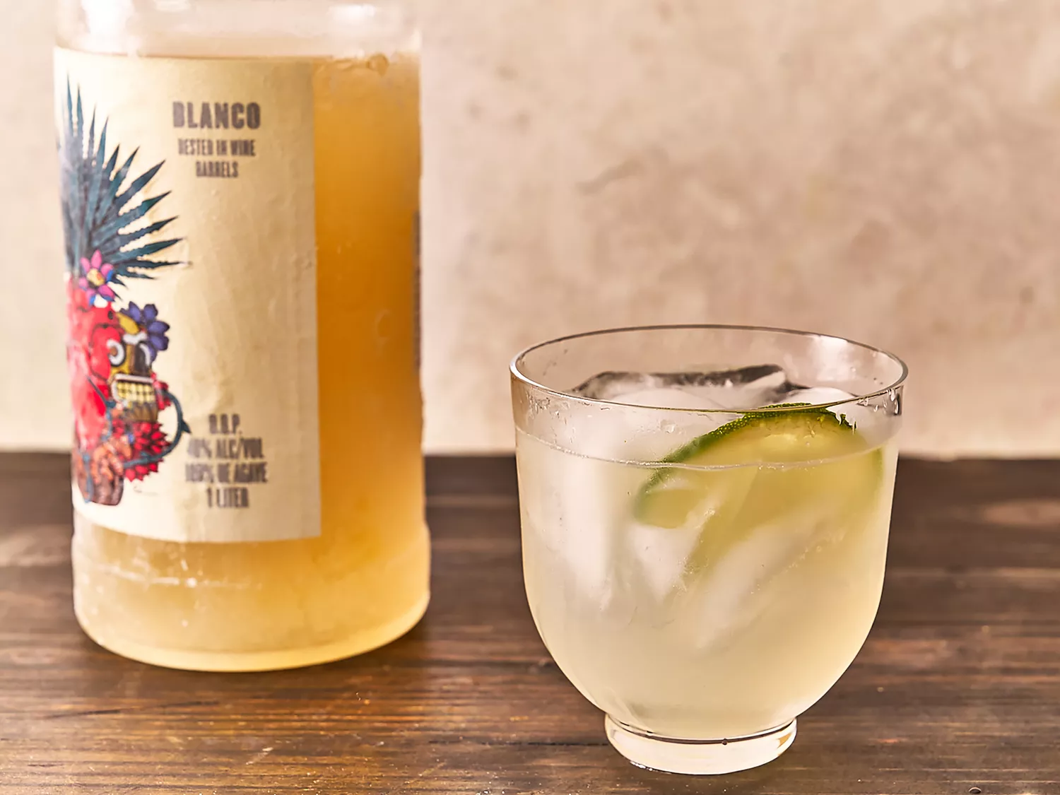 Freezer margarita in glass garnished with lime slice and ice