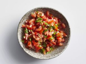 Classic pico de gallo sprinkled with cilantro in bowl