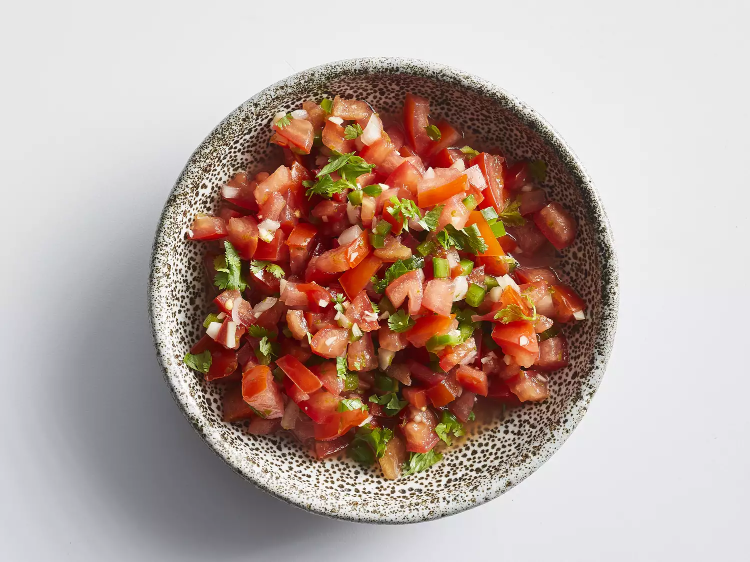 Classic pico de gallo sprinkled with cilantro in bowl