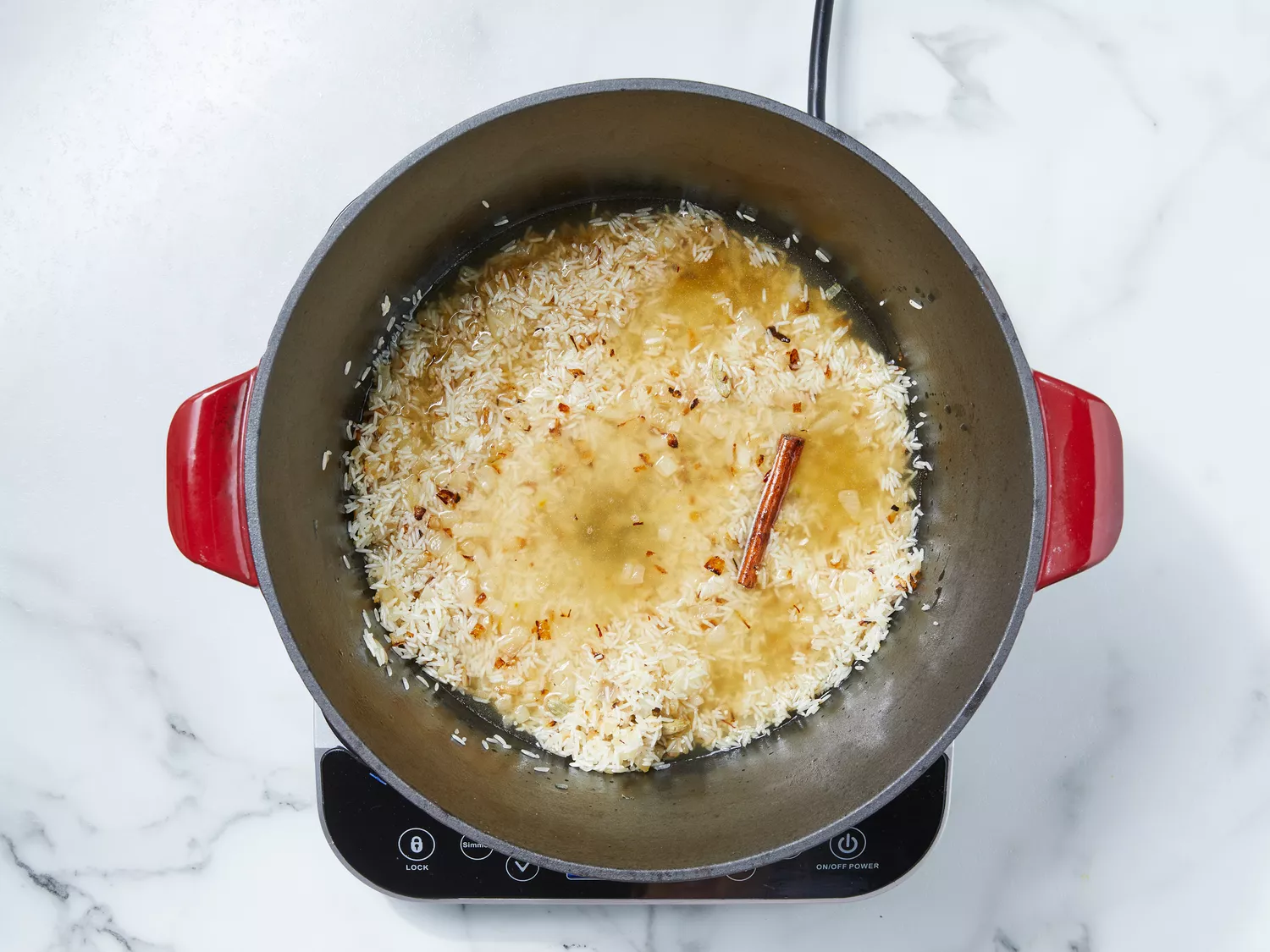 stock poured over rice, stirring well.