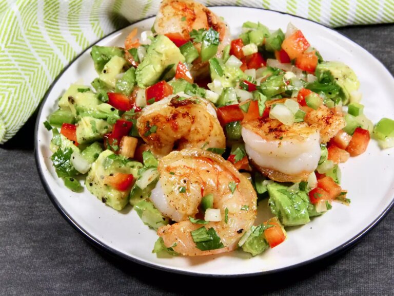 Shrimp and garlic over salad