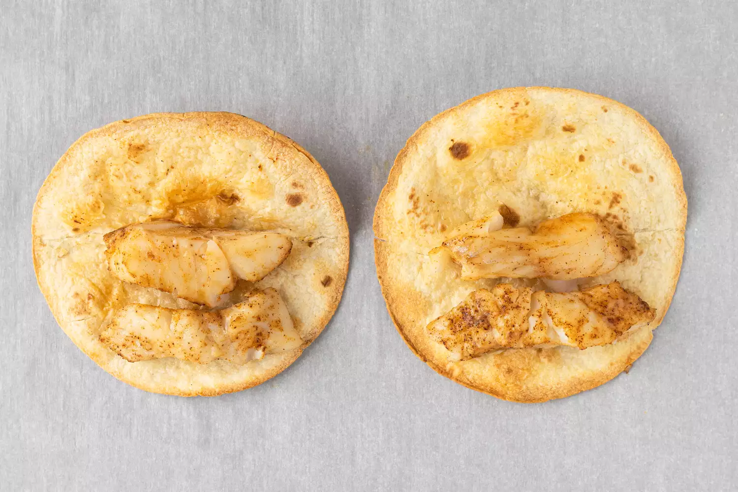 Baked fish on tortilla shells. 