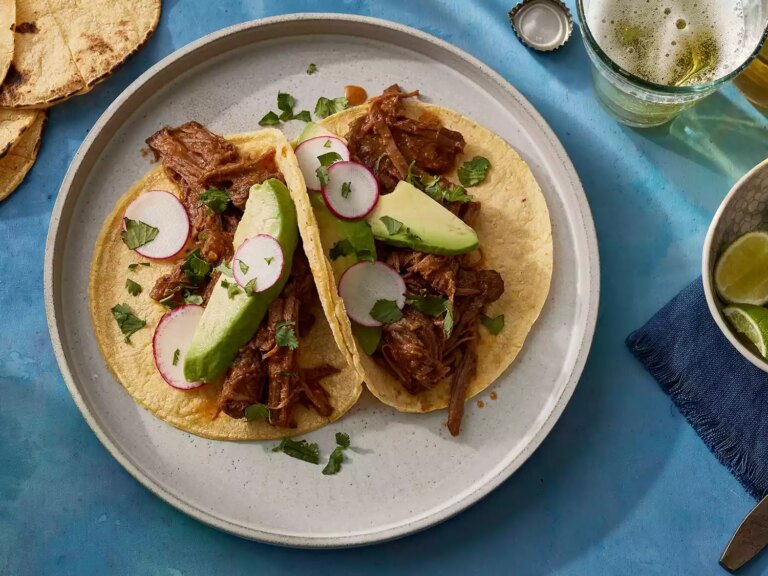 Looking down at two barbacoa tacos